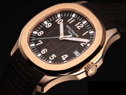 Rose gold Patek Philippe 5167R watch with black dial on a dark background