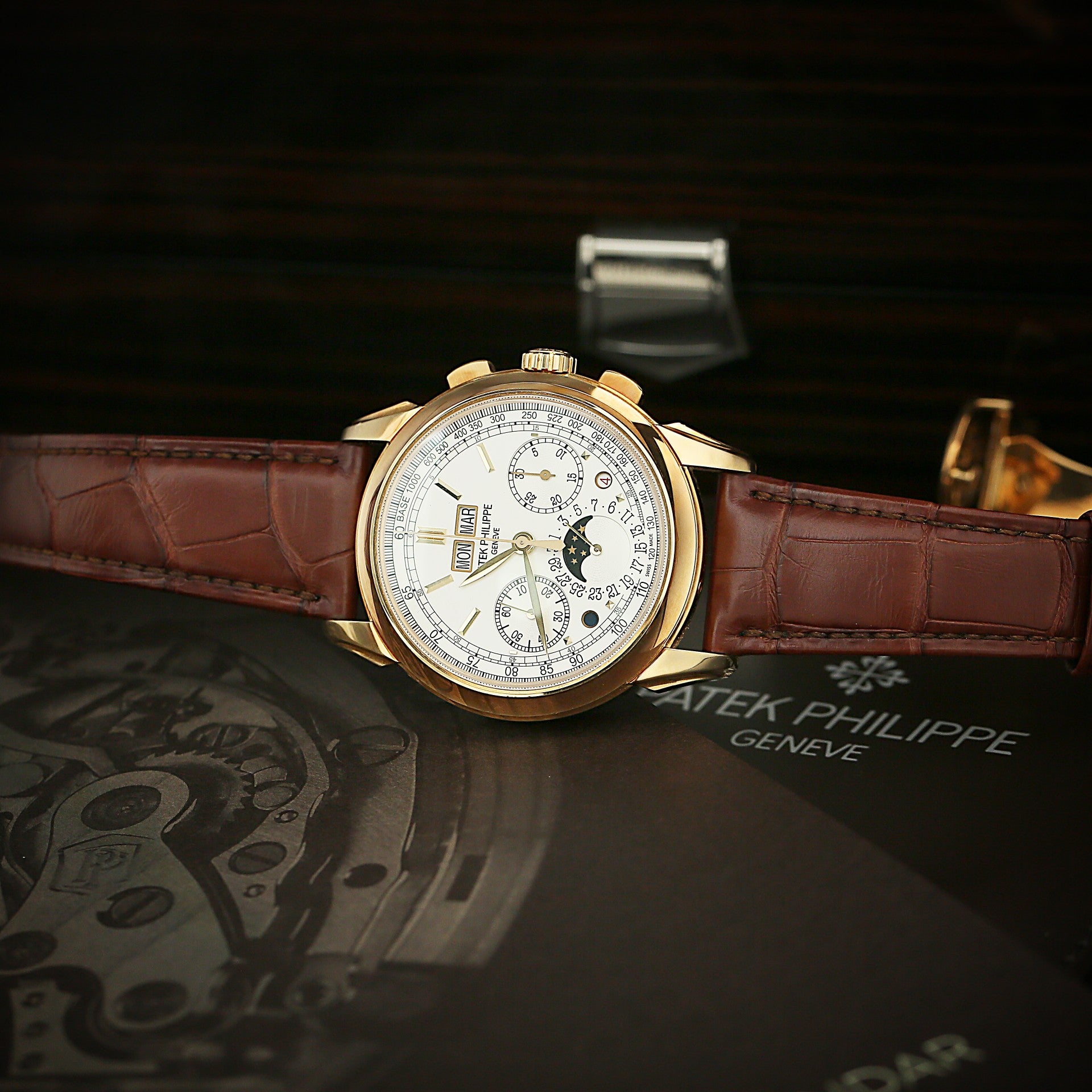 Patek Philippe 5270J watch with brown leather strap on a dark background