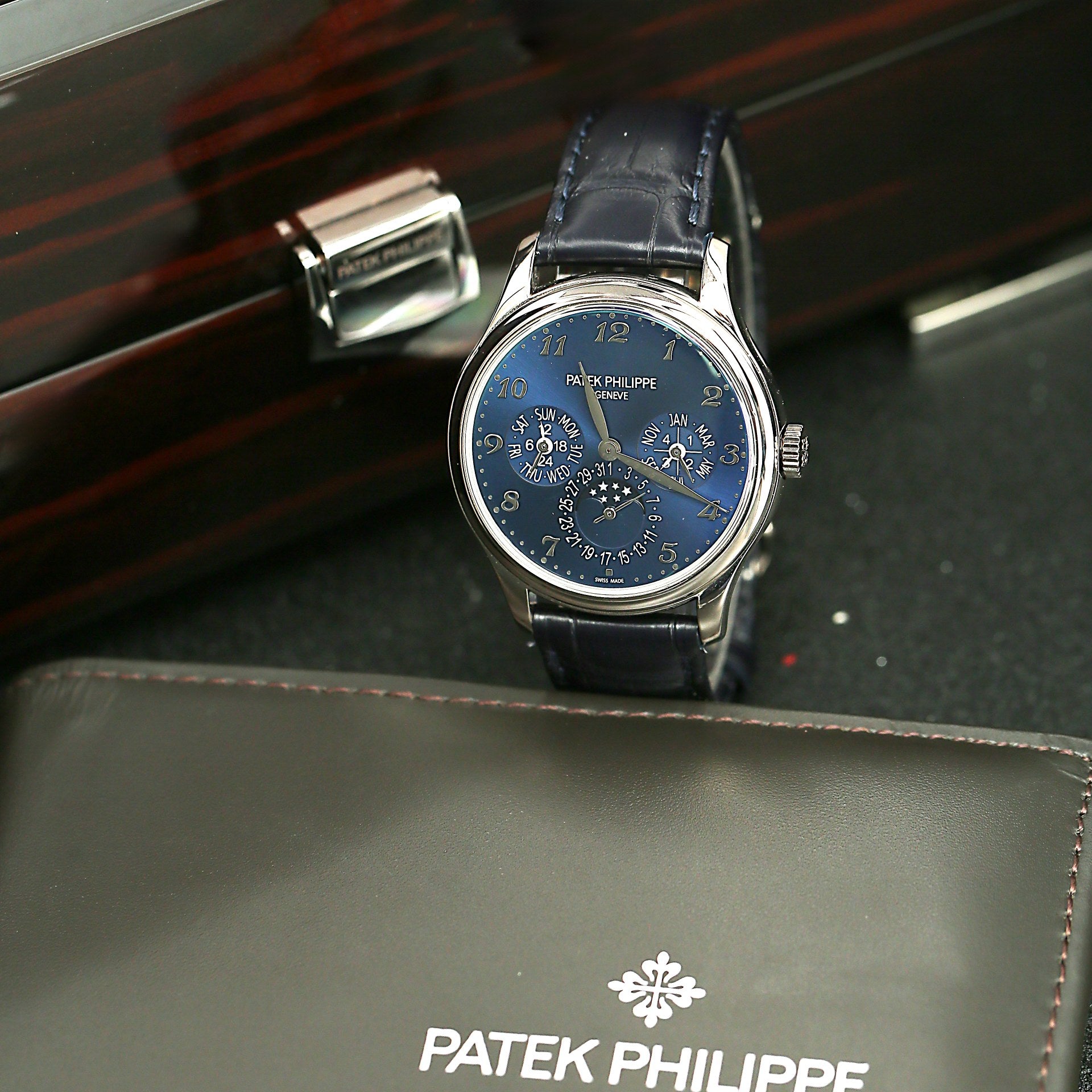 Patek Philippe watch with blue face and dark leather strap with box and papers