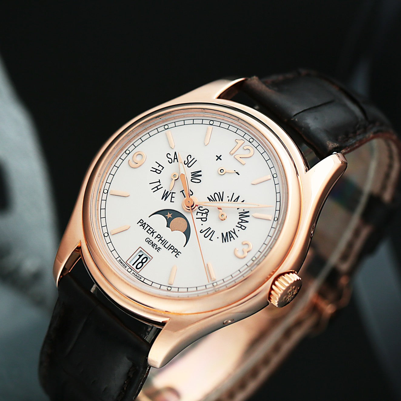 Patek Philippe 5146R with rose gold case and black leather strap on a dark background