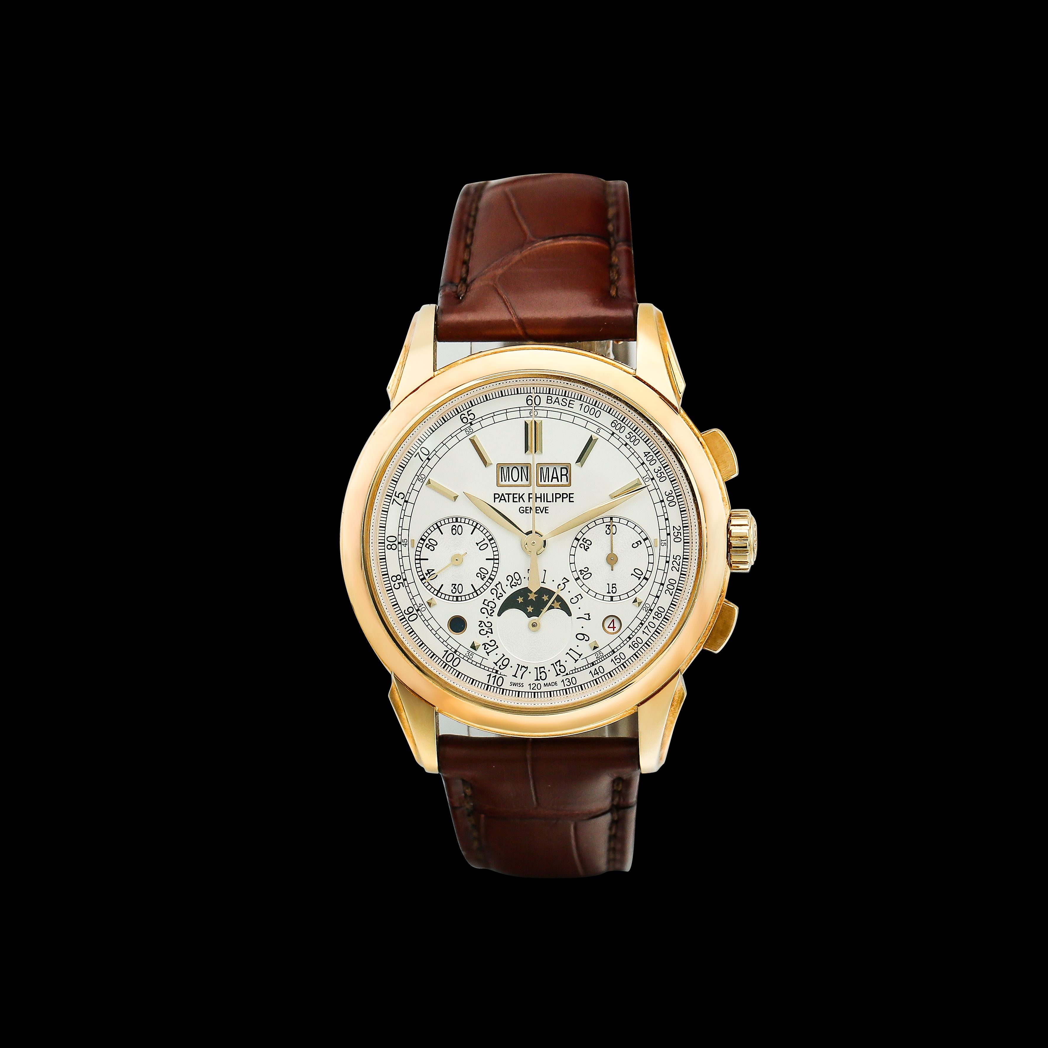 Patek Philippe 5270J  with brown leather strap and gold casing on a black background